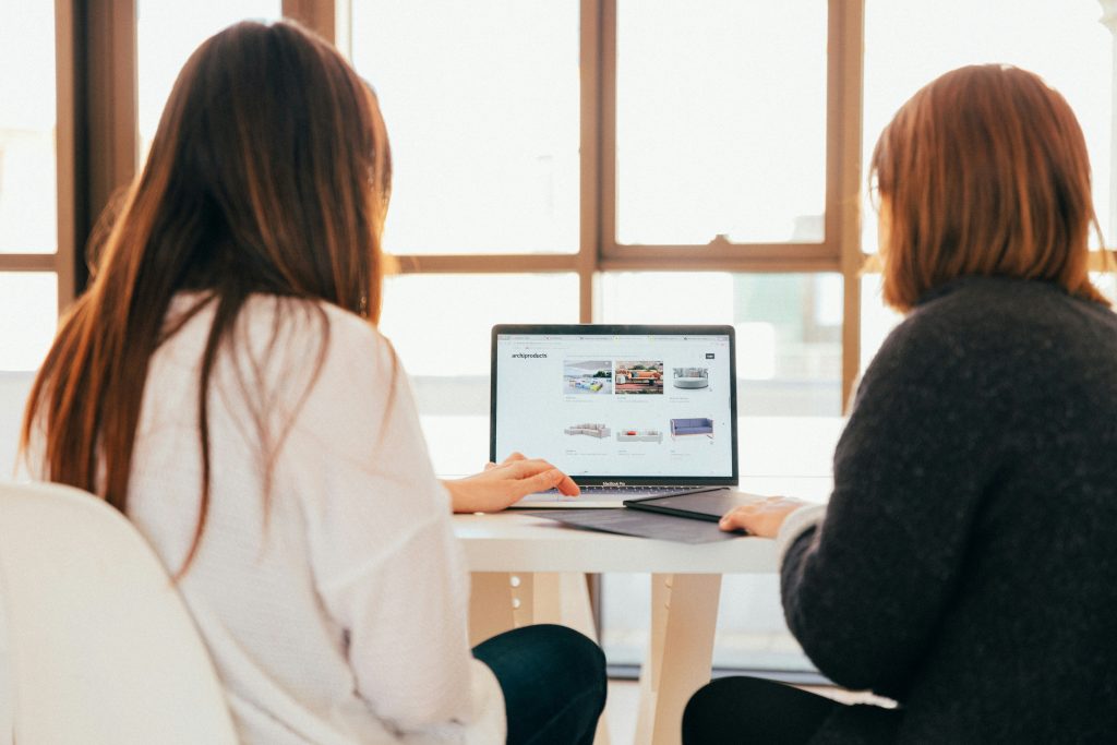 two women working together